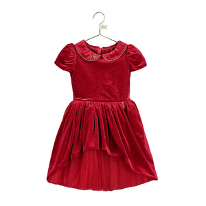 This rich ruby velvet Snow White dress from Disney is adorned with a gold piped Peter Pan collar. It has pretty gathered short sleeves. The full velvet skirt has a high - low hemline revealing a red twinkling