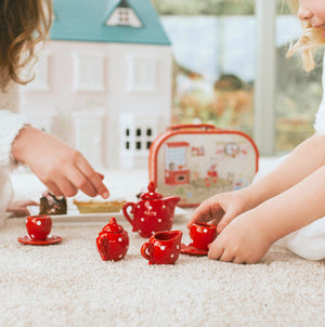 Red ceramic children's tea set by Moulin Roty - a red and white spotty miniature tea set for children available at giftsforagirl.co.uk