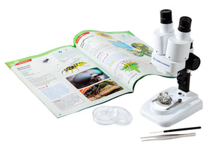 3D Microscope shown in use looking at rock with Petri dish and tweezers with instruction manual - Microscoping with this high quality stereo microscope is a real eye opener! This binocular style 3D microscope from Thames and Kosmos is so easy to use for children and adults as you’re not trying to cover or shut one eye to get a clear focus on what your viewing through the lens. There’s an amazing micro world to explore. Included in the package is 2 x 5mm lens and 2 x 10mm lens. 
