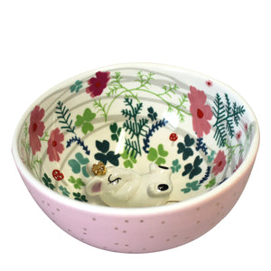 Mouse Bowl - Disaster Designs - aerial view. The porcelain bowl has a pretty pale pink glaze on the outside with gold foil polka dots. 