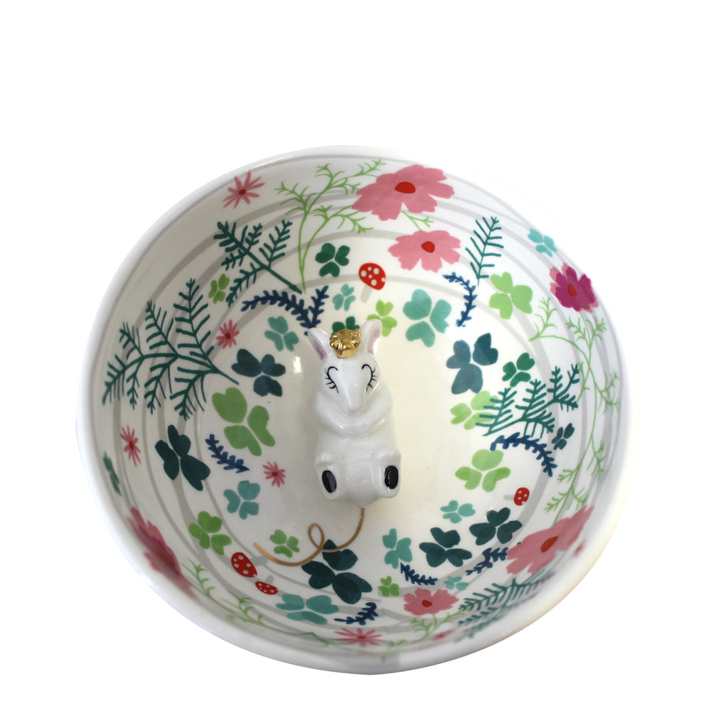 Mouse Bowl - Disaster Designs - aerial view. The porcelain bowl has a pretty pale pink glaze on the outside with gold foil polka dots. 