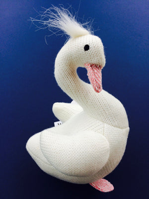 White Swan Rattle Soft Toy – an adorable gift for baby This beautiful cute swan is knitted with white cloth and has a pretty pink tweed beak and feet. It also has a tuft of fluffy white fuzz on the top of her bowed head and beautiful black stitched eyes. This white swan rattle soft toy makes a gorgeous gift for new babies, christenings, birthdays and Christmas. Shown on blue background