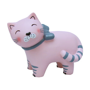 A gorgeous children's light depicting a happy pink cat wearing a grey bow. At bedtime, it's reassuring for some to have a children's night light in the room. What better way to create an atmosphere of calm than a pretty pink cat night light. Showing unlit cat lamp on white background