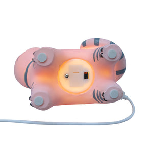 A gorgeous children's light depicting a happy pink cat wearing a grey bow. At bedtime, it's reassuring for some to have a children's night light in the room. What better way to create an atmosphere of calm than a pretty pink cat night light. Showing lit cat lamp from underneath - showing on off switch.