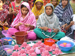 These cotton crochet toys are hand knitted by a team of people in rural Bangladesh, as this is a fair trade toy all the workers are fairly paid. Beautiful bright colours and a rattle sound when you shake the little octopus. 