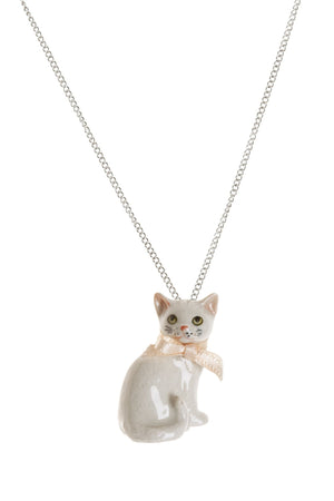 White Cat Necklace - hand painted and beautifully designed white cat with pale pink bow. Intricate detail on the face with yellow eyes and pink nose with whiskers. Hand finished in Scotland